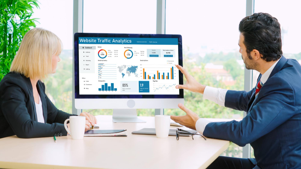 Business owner analyzing website performance and conversion rates after a design optimization.